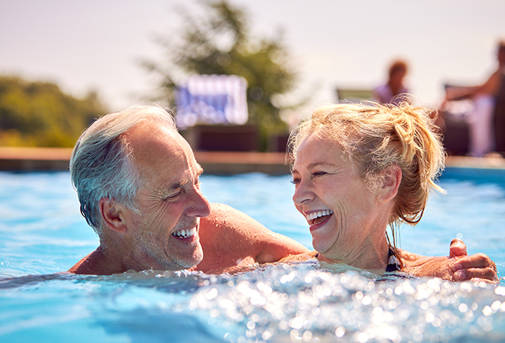 senior couple in pool